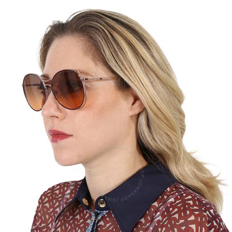 Burberry Brown Gradient Round Ladies Sunglasses .